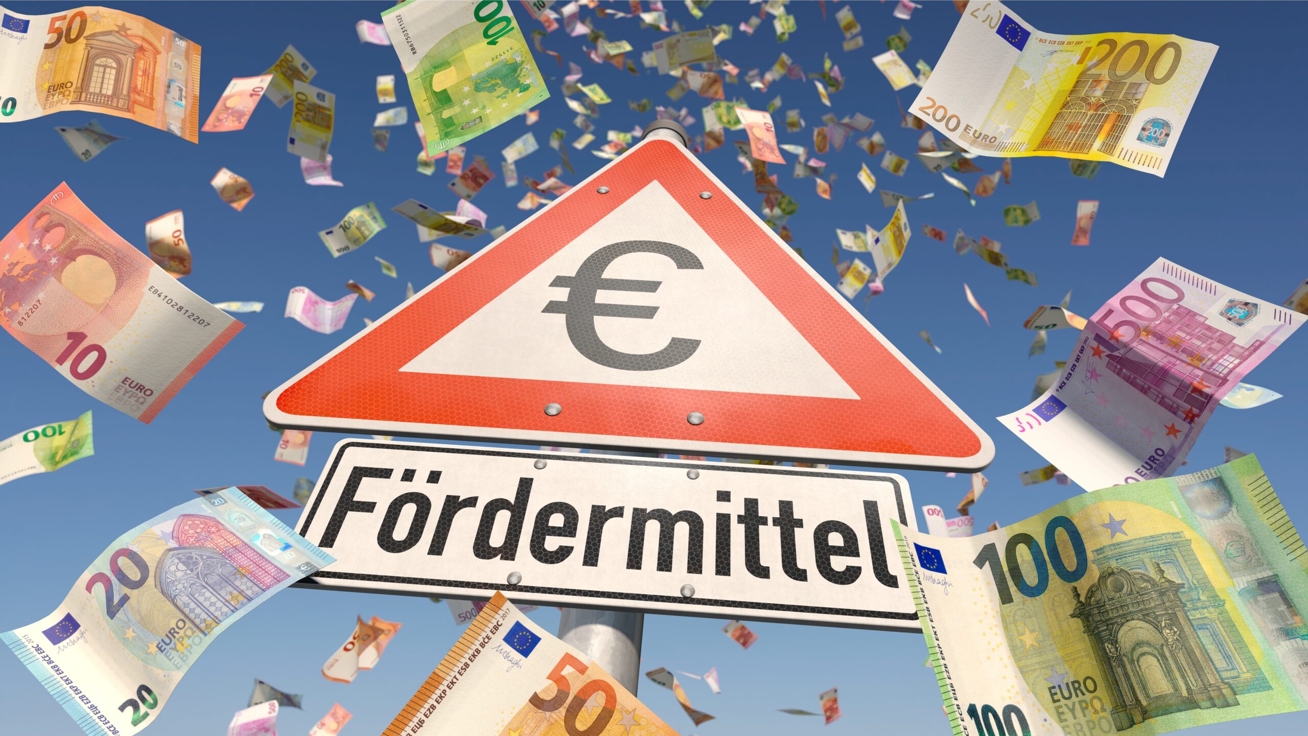 Symbolbild für Fördermittel. Euro-Geldscheine fliegen wie eine Geldregen durch die Luft. in der Mitte des Bildes ist ein Gebotsschild mit einem Euro-Zeichen darunter ein Schild mit der Aufschrift "Fördermittel"